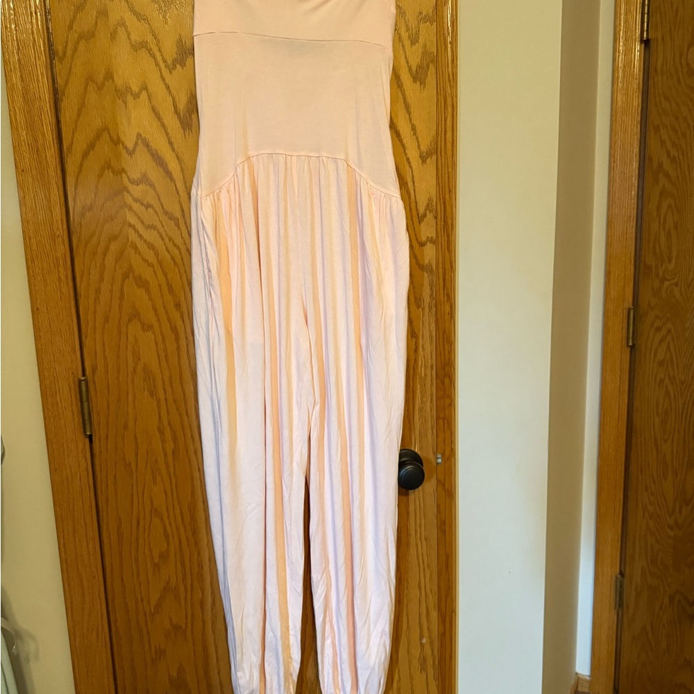 Never worn Light Pink Strapless Jumpsuit size small stretchy with pockets